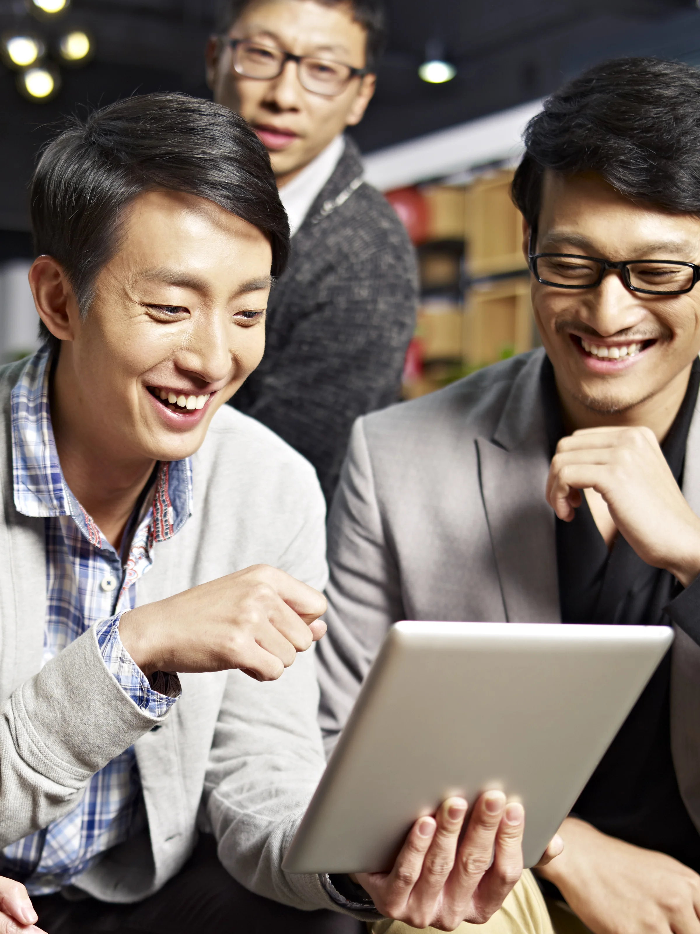 Young people using a tablet together